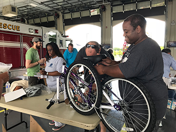 Other Goddard employees building bikes