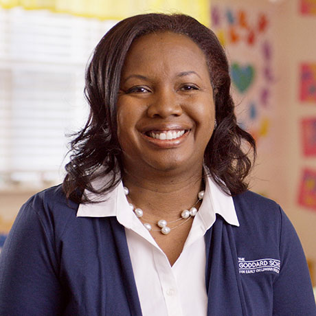 A smiling franchisee who is happy about her decision to invest in a Goddard School franchise.