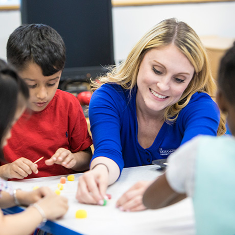 A smiling franchisee who is happy about her decision to invest in a Goddard School franchise.